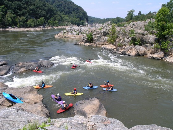Kayakers wait to paddle Maryland Chute on the Potomac.